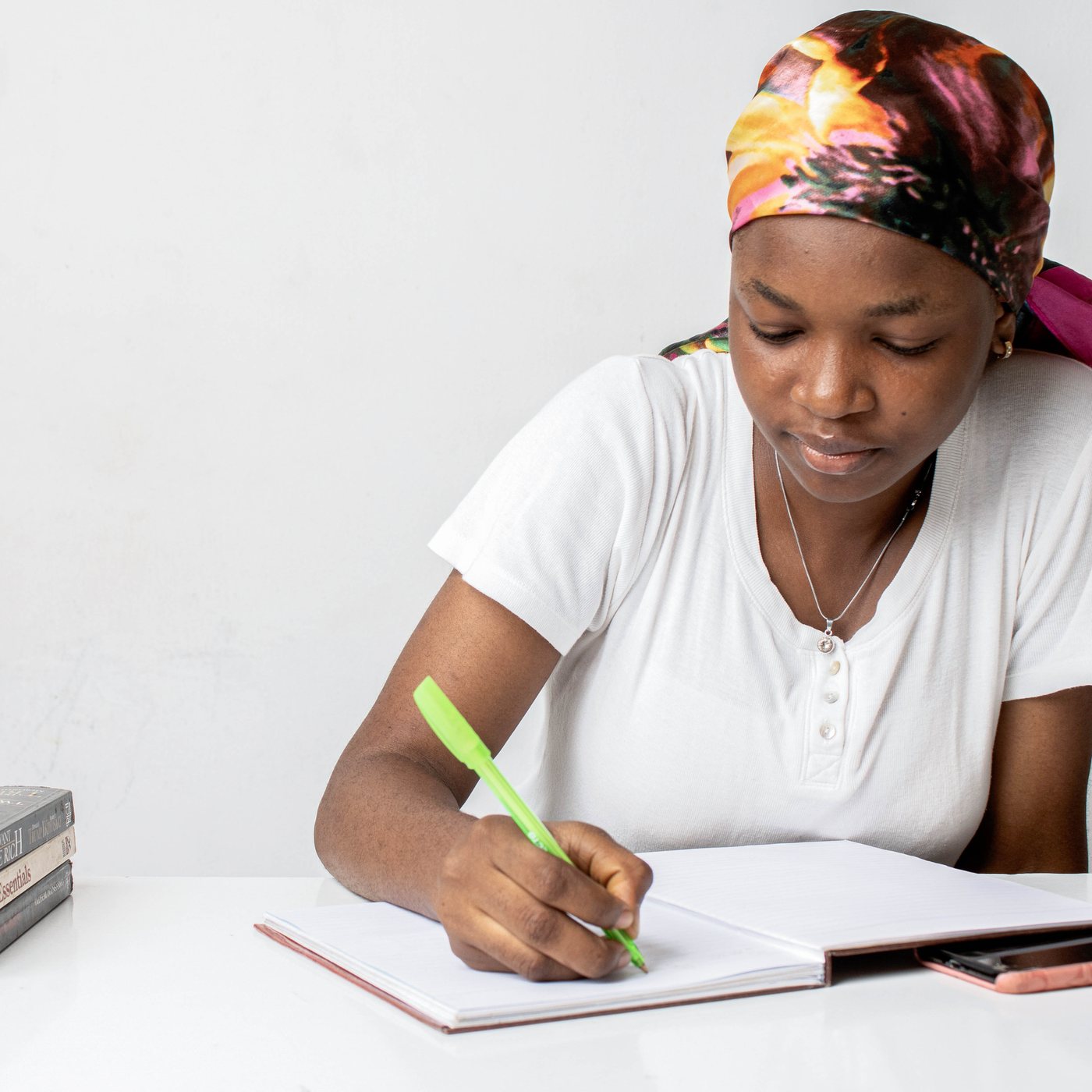 A young woman studying with her notebook open